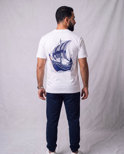 The Dhow Tee back view on model