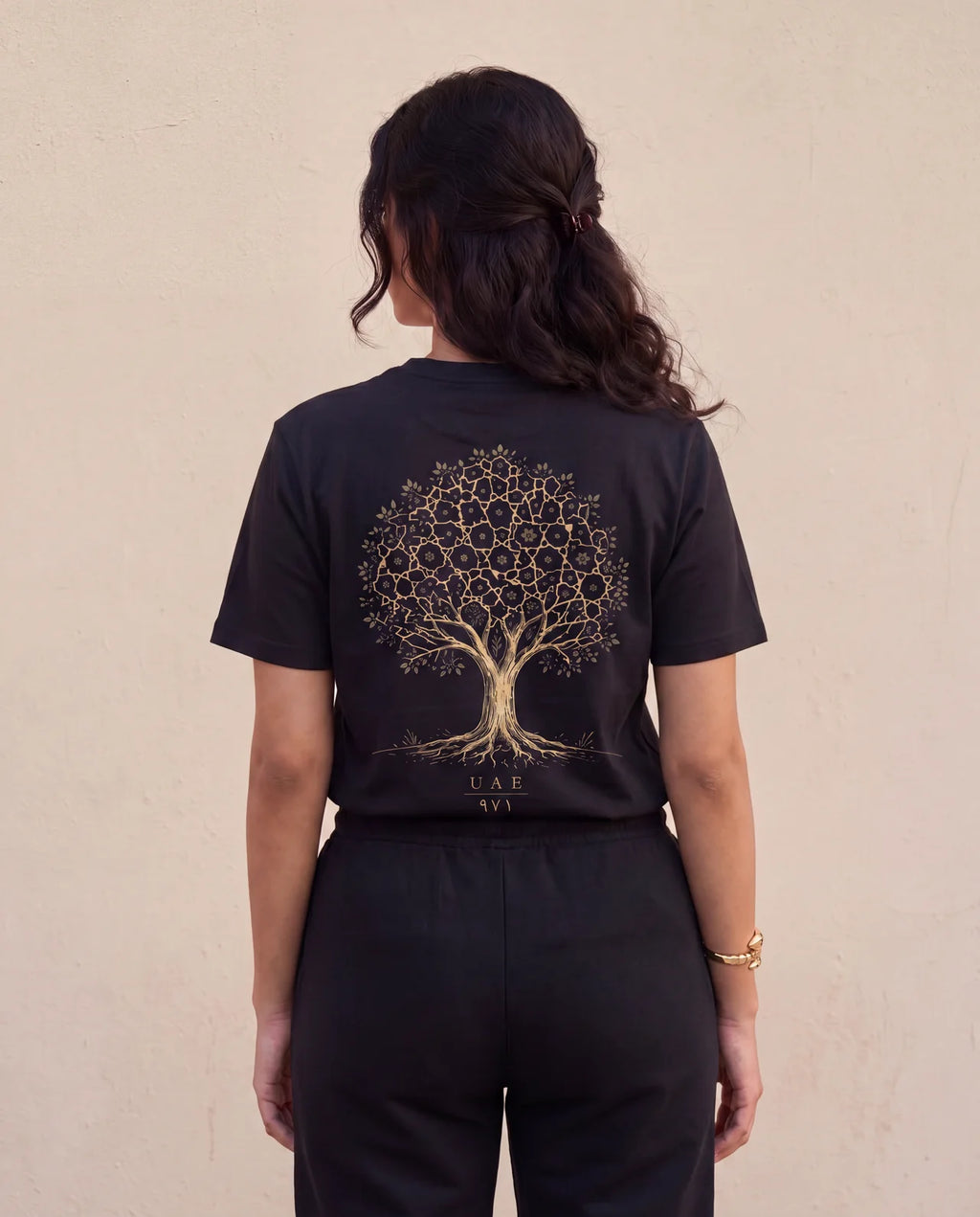 The Ghaf Tee back view on model