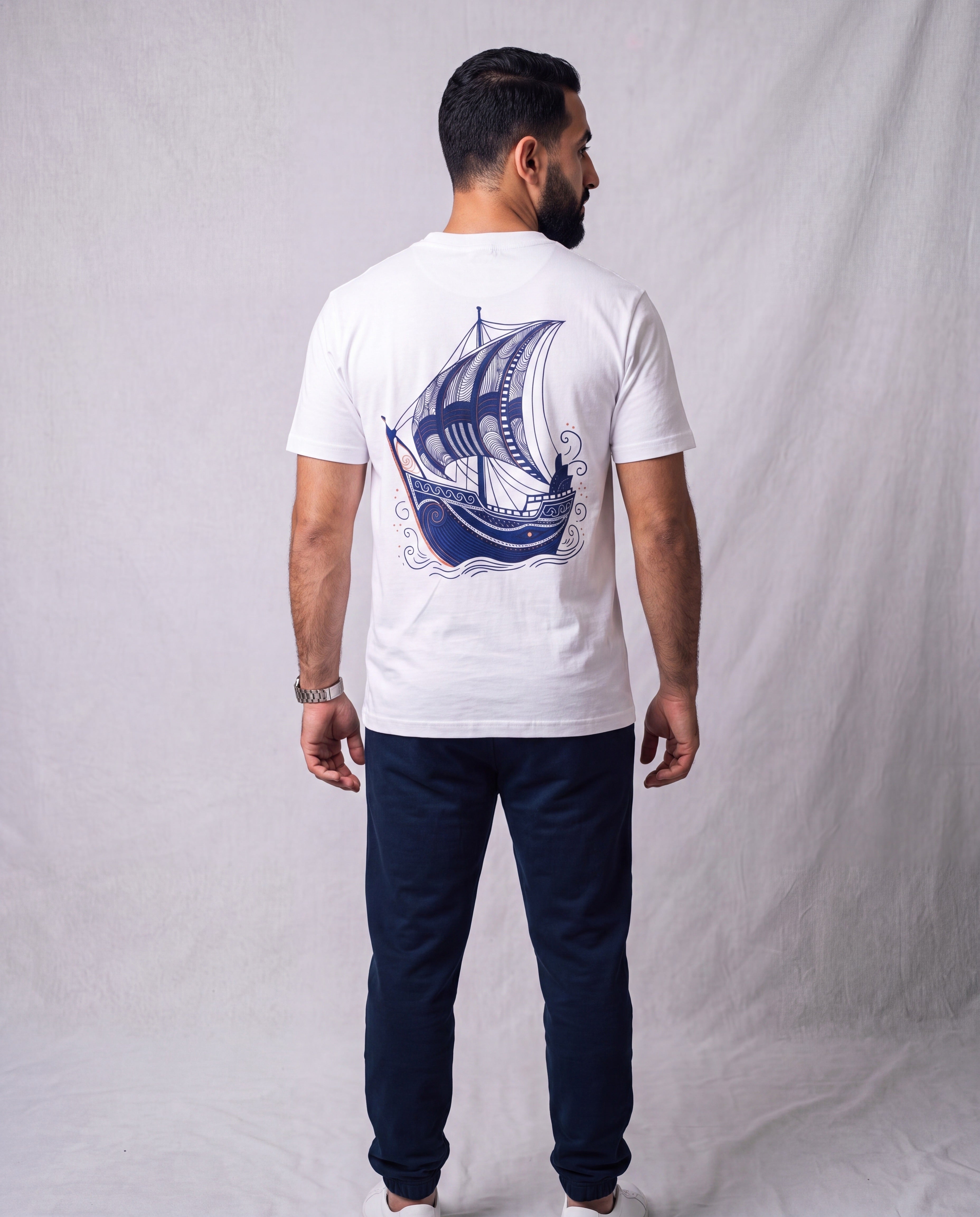 The Dhow Tee back view on model