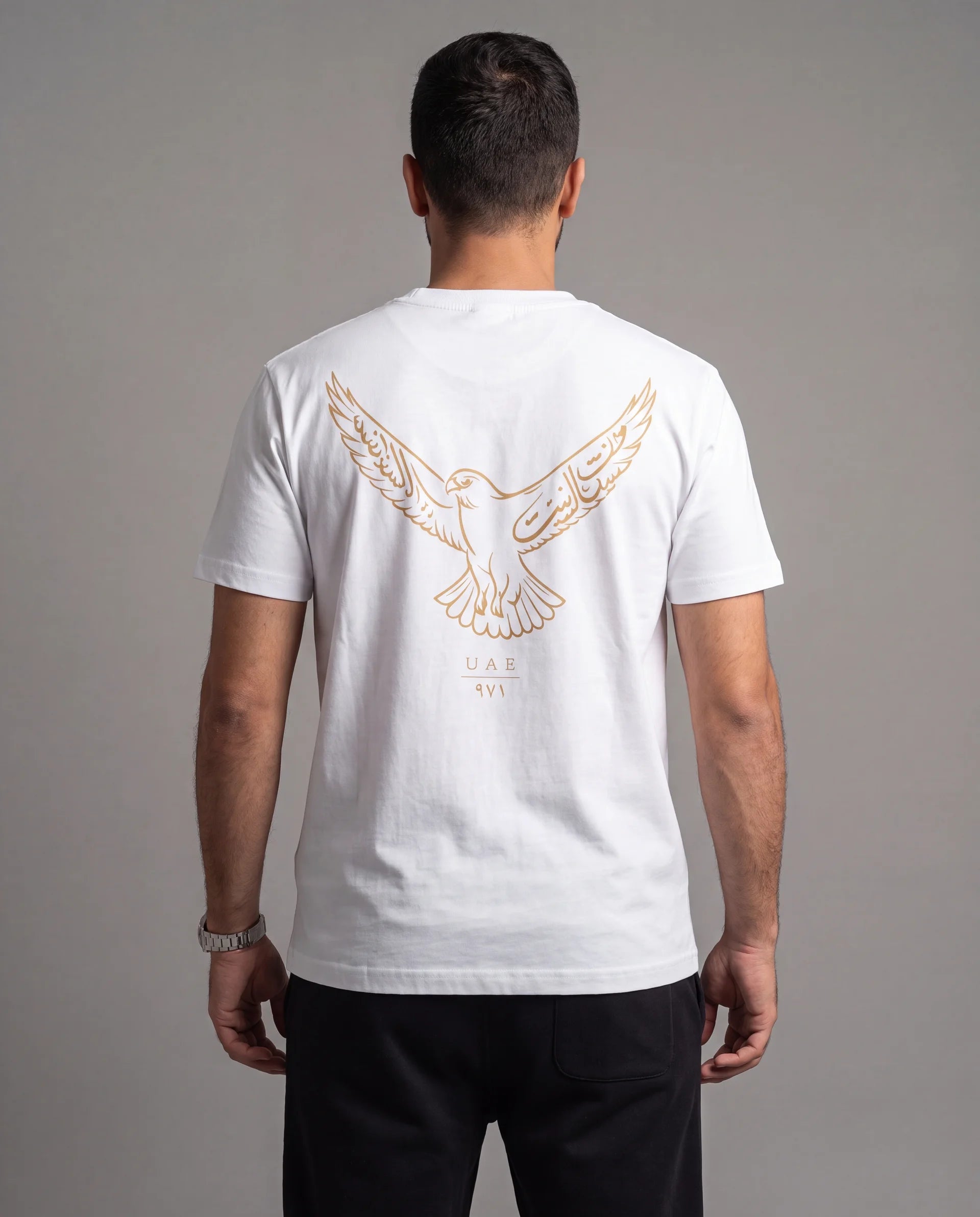 The Falcon Tee in white, back view on model