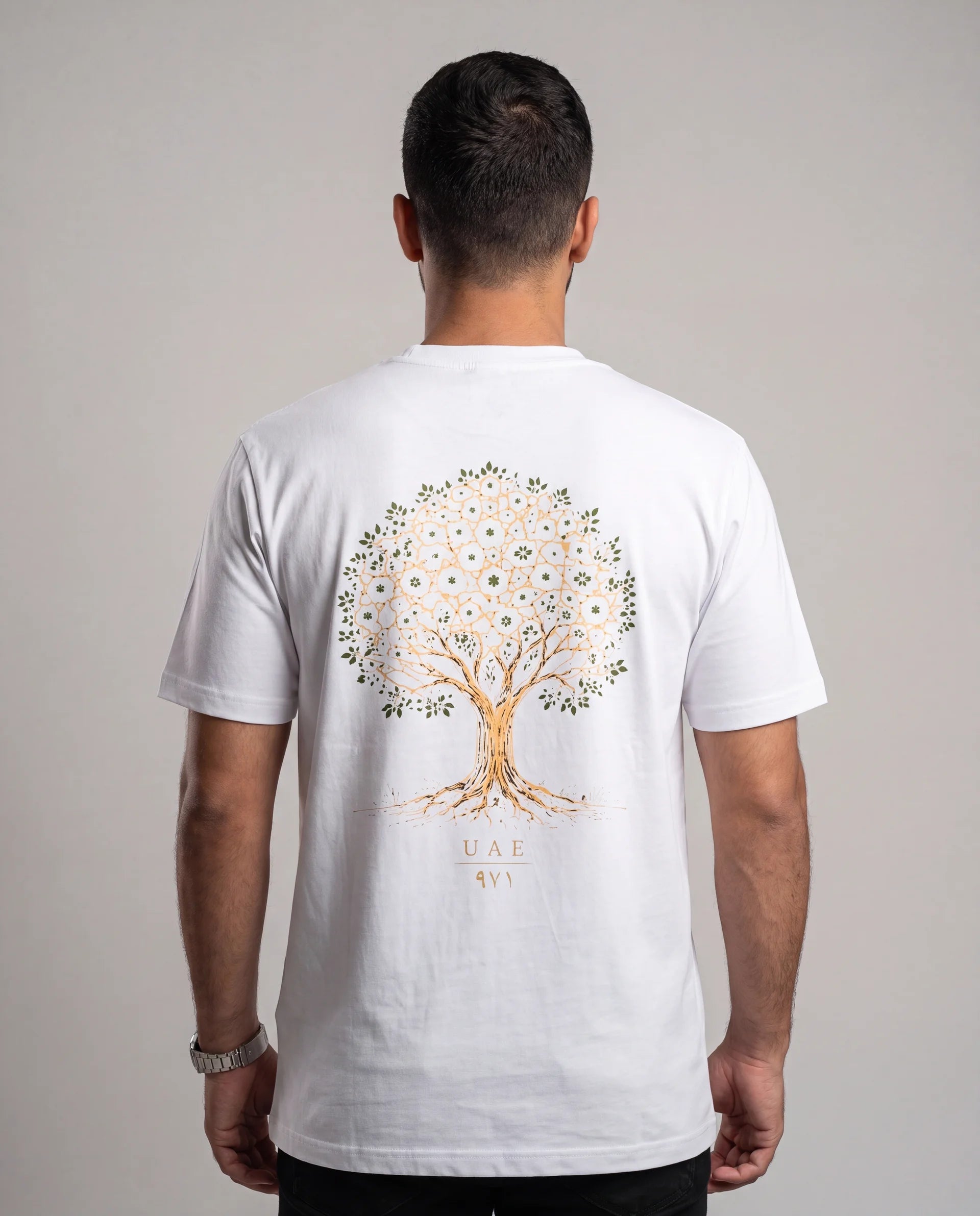 The Ghaf Tee in white, back view on model