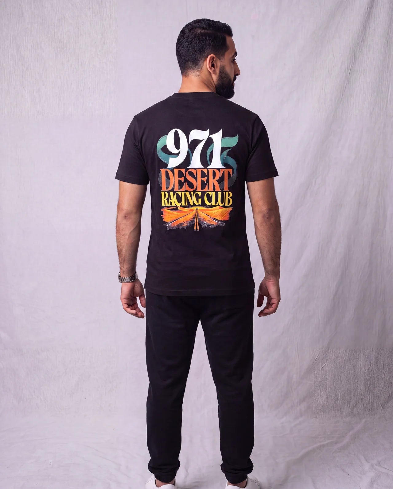 The Racing Club Tee back view on model
