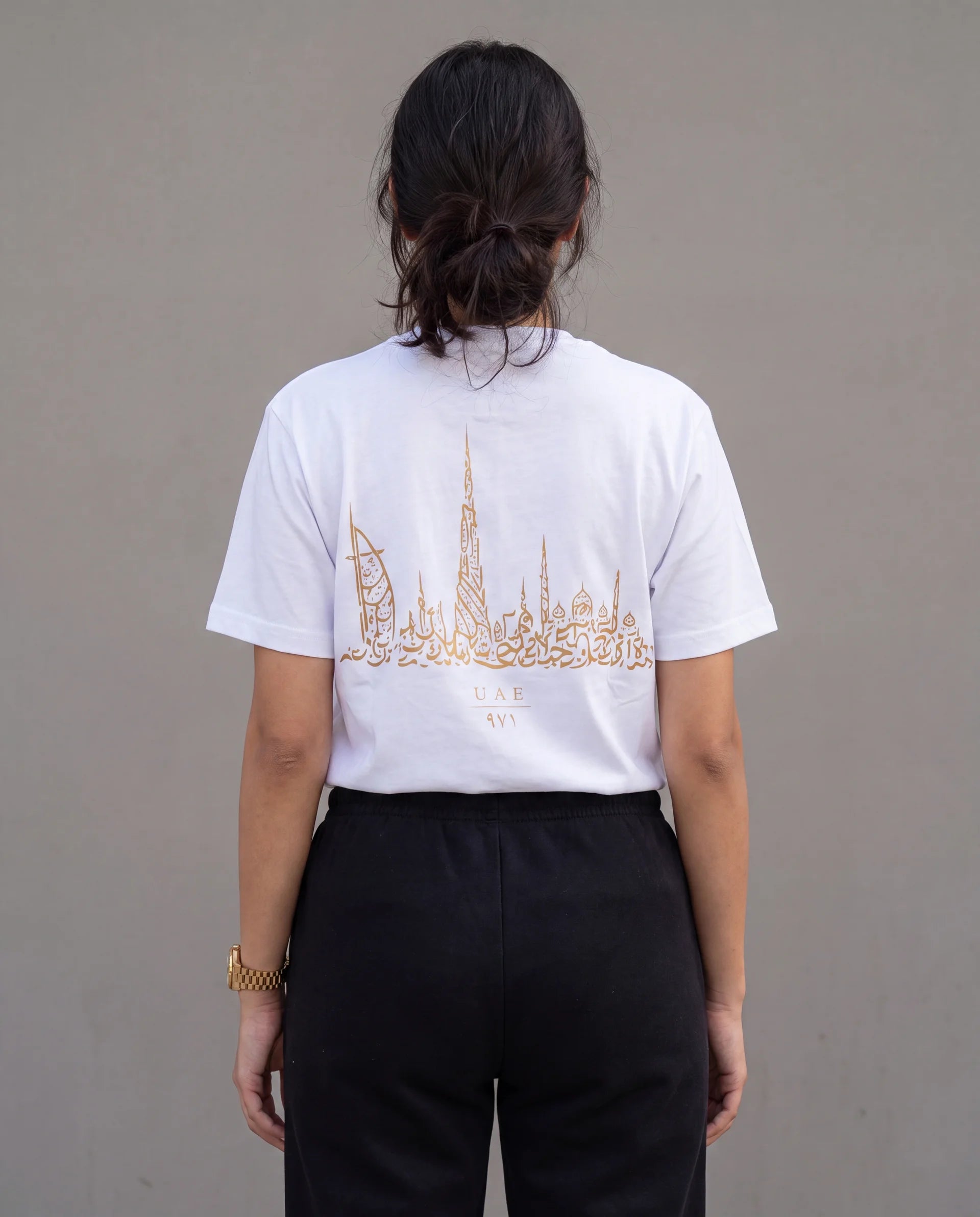 The Skyline Tee in white, back view on model